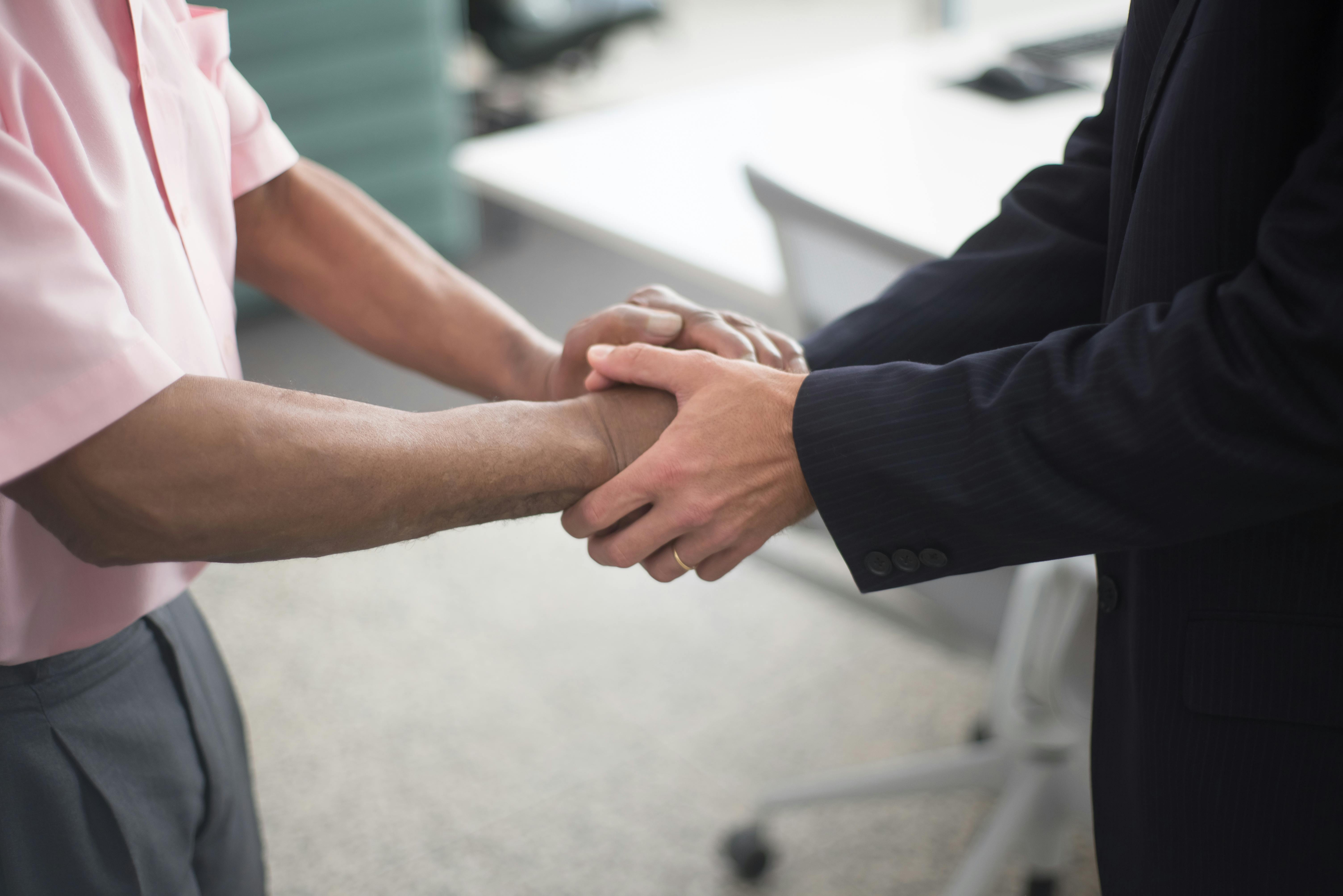 Business handshake representing a trusted mystery shopping partnership